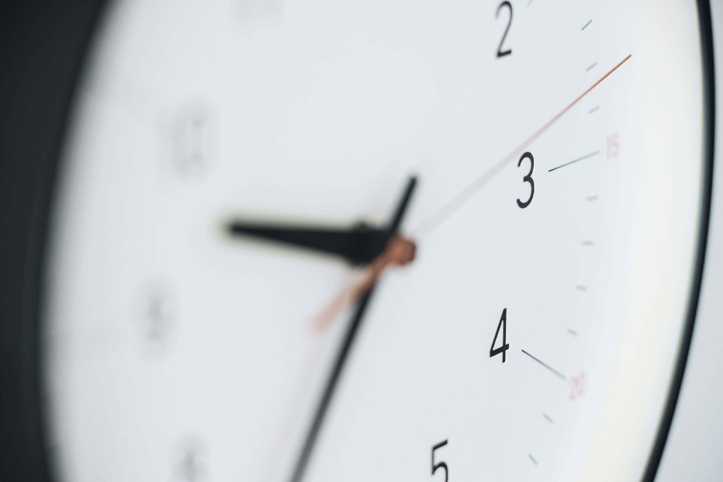 Close-up of the Essent Clock face showing clear numerals and hands, embodying modern elegance and high-quality craftsmanship.