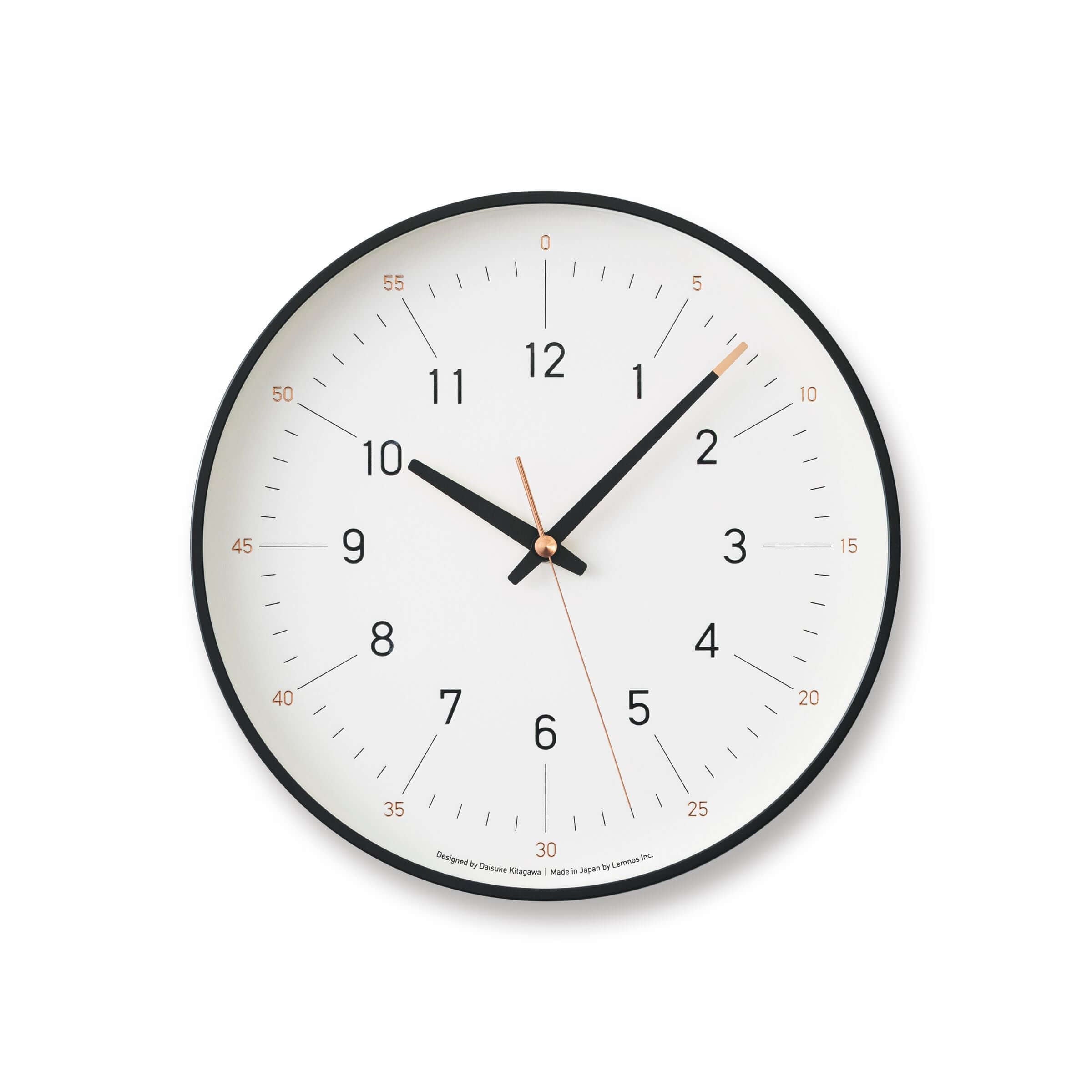 Essent Clock in white, showcasing modern design with clear numerals and stylish clock hands.