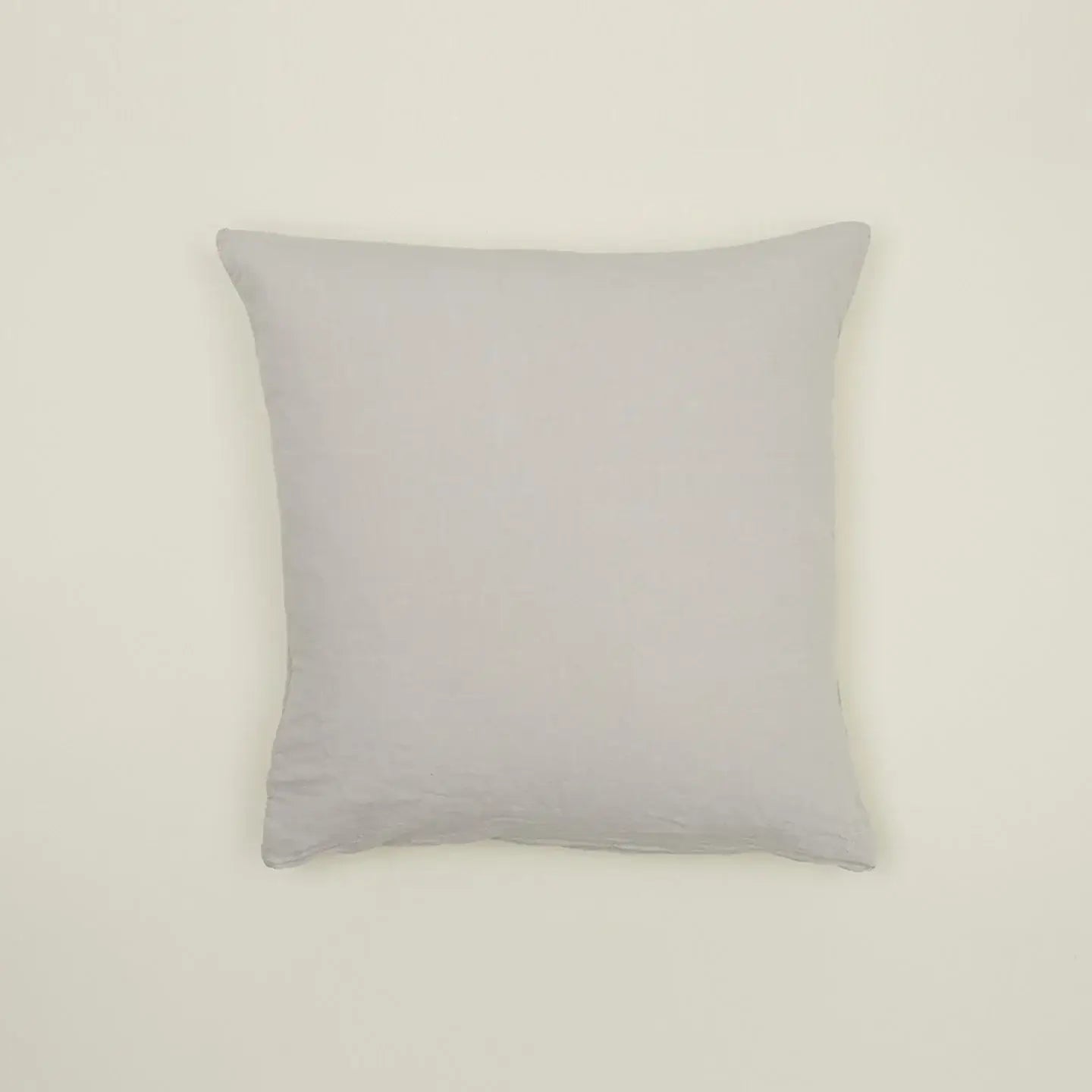 Simple light gray linen pillow, made from Belgian linen, adding casual luxury to any cozy space.