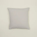 Simple light gray linen pillow, made from Belgian linen, adding casual luxury to any cozy space.