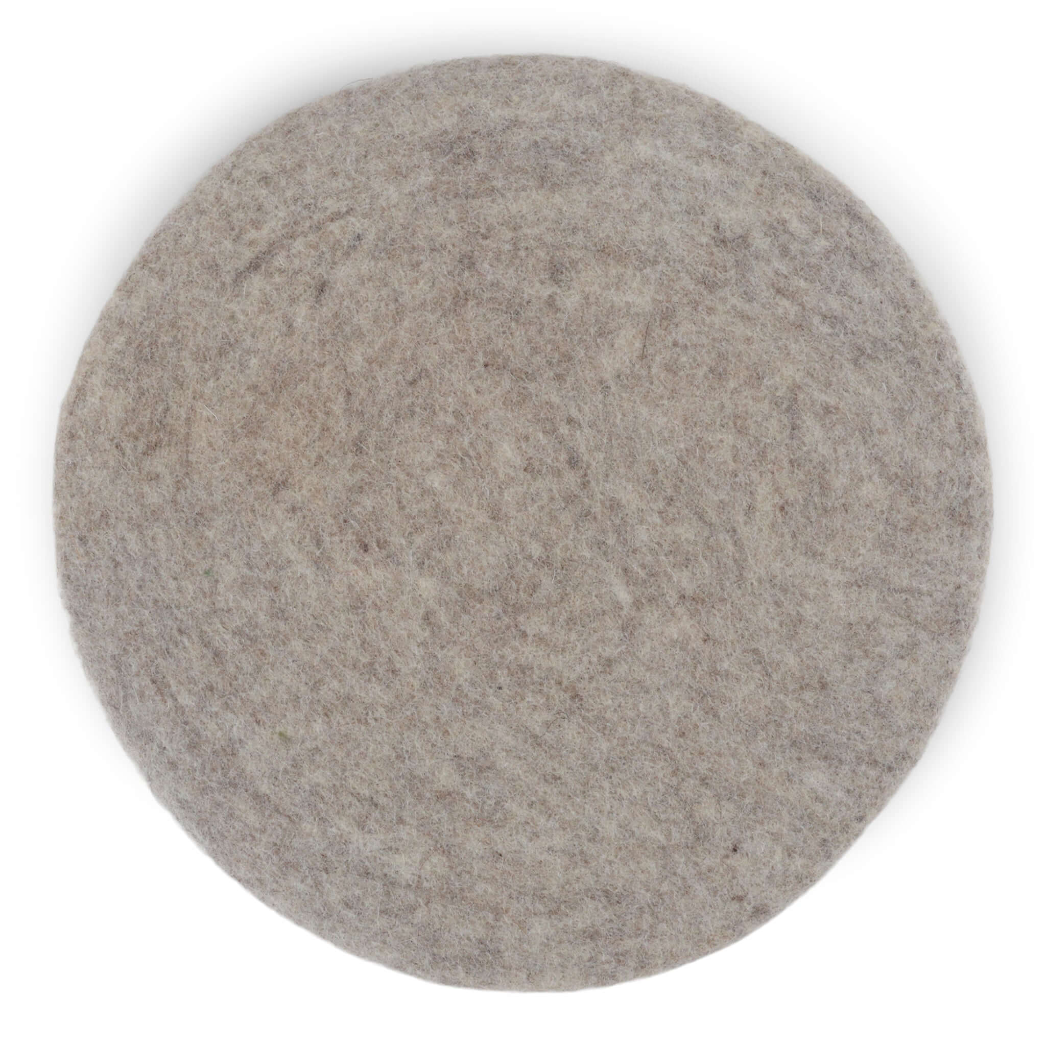 Round felt wool seat cushion in soft gray, handmade from 100% New Zealand wool, ideal for extra comfort on hard surfaces.