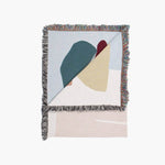 Arthur Throw designed by Laurie Maun, woven eco-friendly blanket in abstract colors, perfect for home decor.
