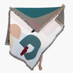 Arthur Throw blanket by Laurie Maun, colorful and eco-friendly woven design, perfect for decor or cozy use.