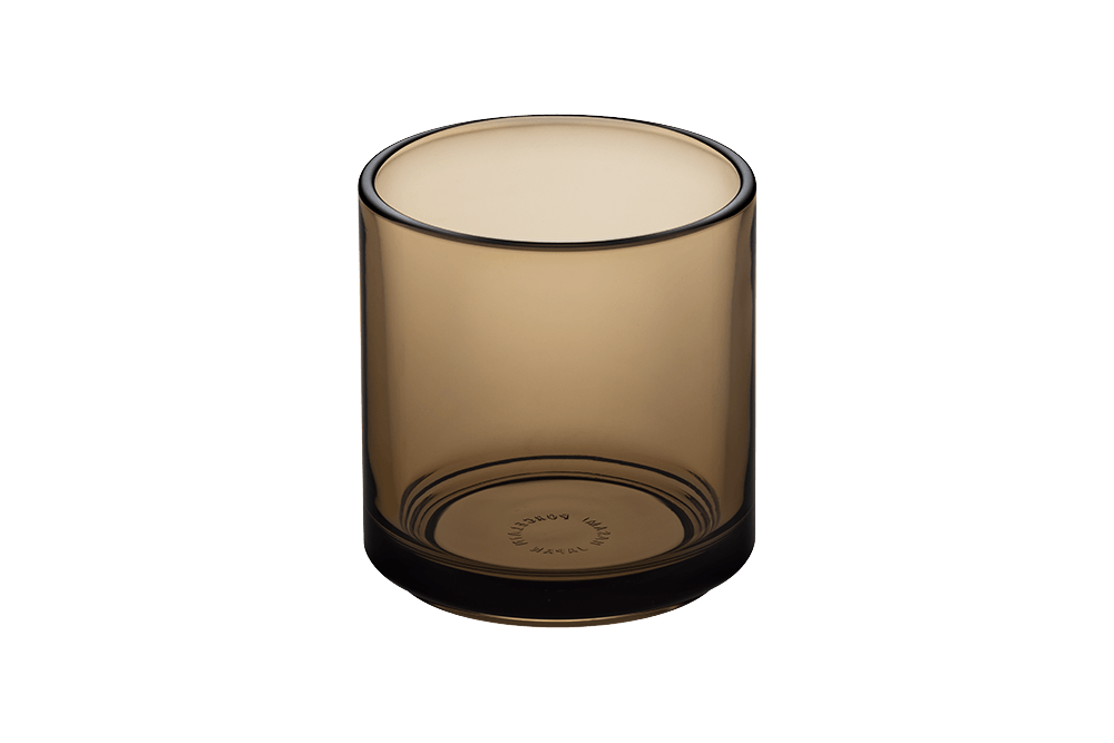 Hasami Porcelain Amber glass tumbler showcasing a modern, modular design with a warm amber hue.