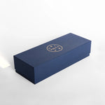dark blue rectangular product box with volta logo in gold