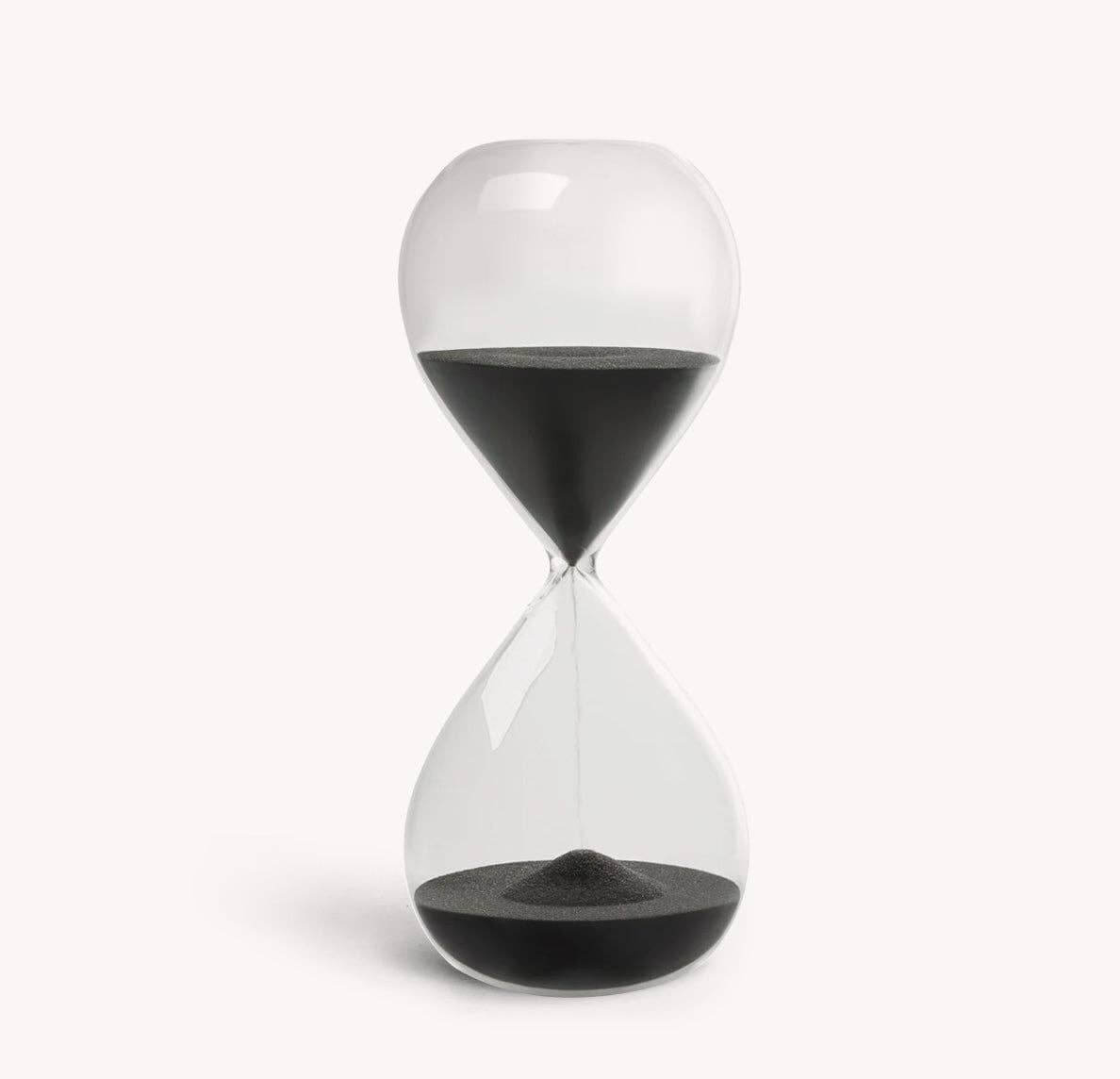 Desktop 30 minute hourglass in jet black with clear glass, designed for productivity and focus, dimensions 7.87" x 3.14".