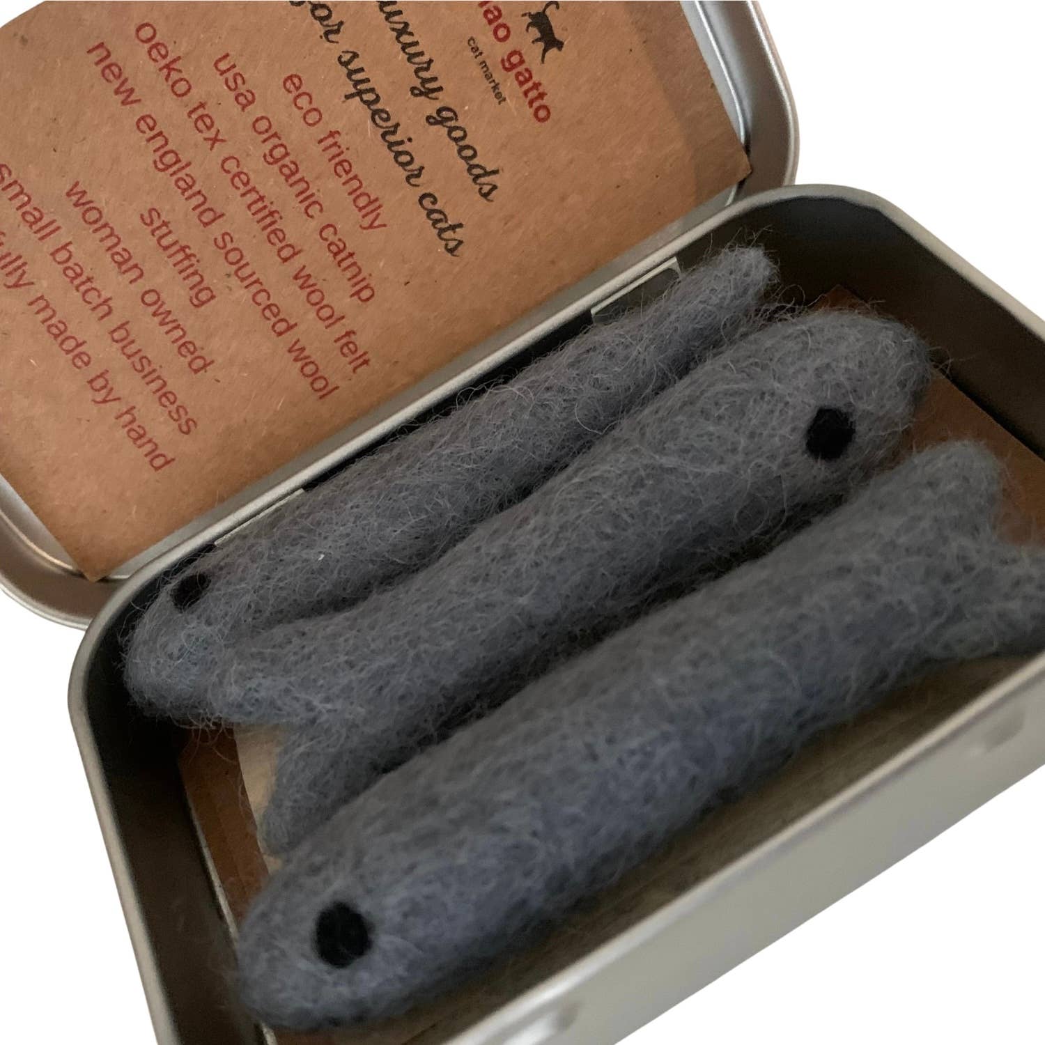 Three gray catnip toys in a metal tin with a brown label.