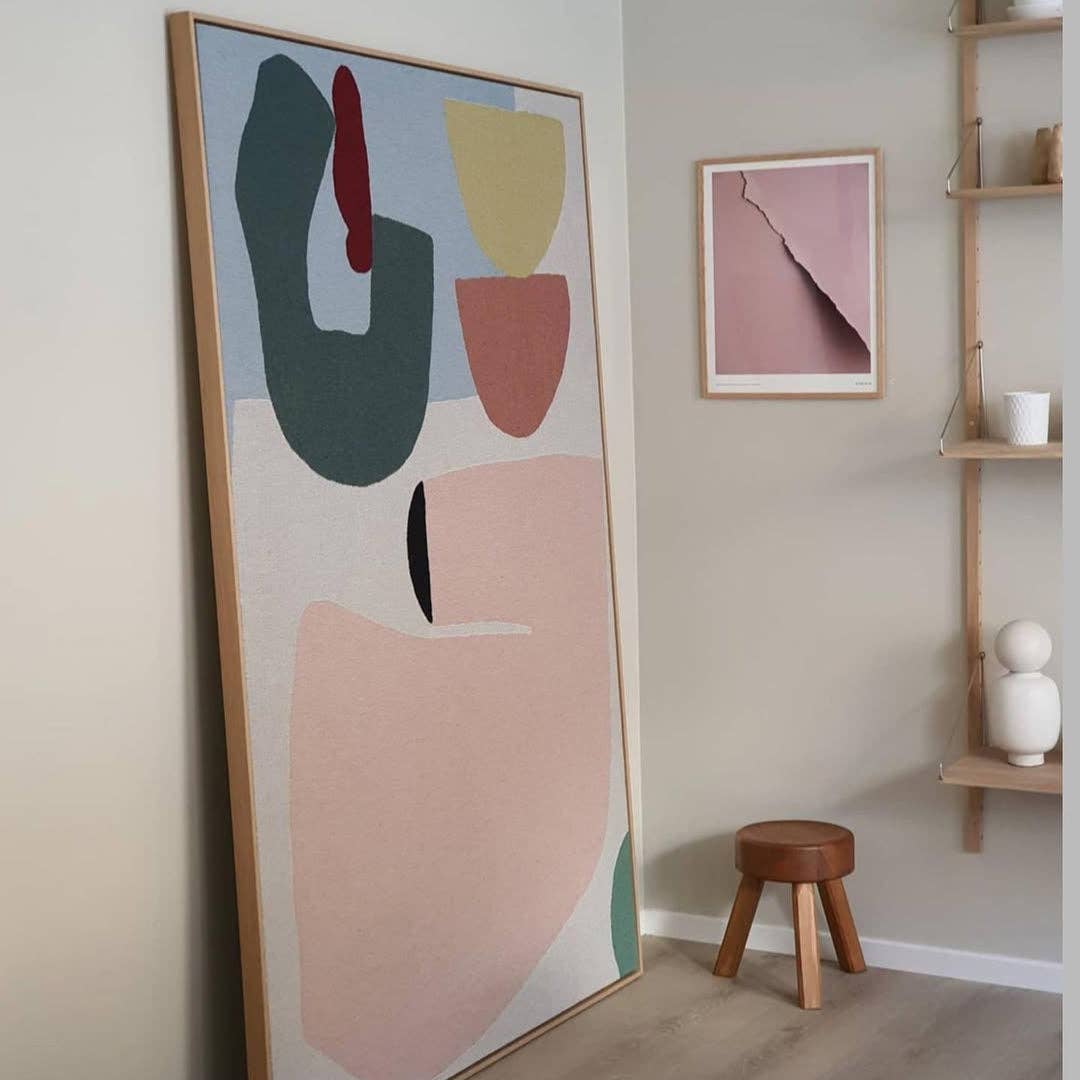 Arthur Throw Blanket showcasing abstract patterns, hung on the wall as decor.