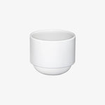 Hasami Porcelain rounded bottom tea cup in white, showcasing modern design and multifunctional features.