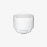 Hasami Porcelain rounded bottom tea cup in white, showcasing modern design and multifunctional features.