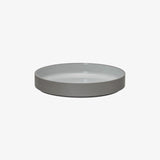 Hasami Porcelain Grey Collection bowl in matte grey with glossy ash white interior, showcasing elegant modern design.