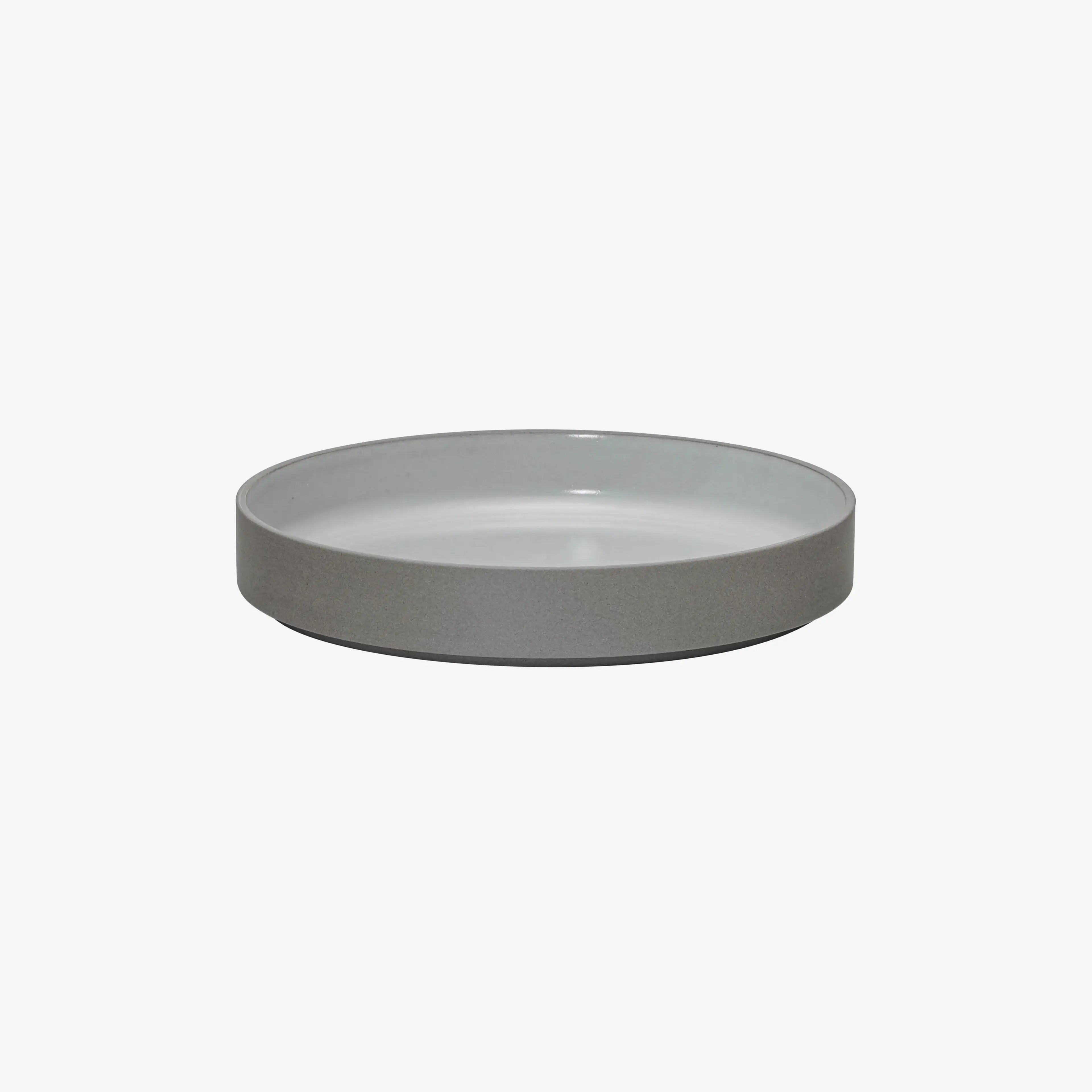 Hasami Porcelain Grey Collection bowl in matte grey with glossy ash white interior, showcasing elegant modern design.
