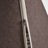 Close-up of a zipper on brown pet bed.