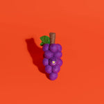 Purple grape cluster shaped toy with a face on an orange background