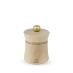 A Peugeot Baya salt grinder made of natural beechwood with a stainless steel knob on top, displayed against a plain background.