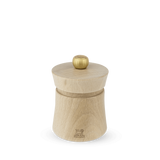 A Peugeot Baya salt grinder made of natural beechwood with a stainless steel knob on top, displayed against a plain background.