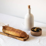 gharyan matte white stoneware bottle on table