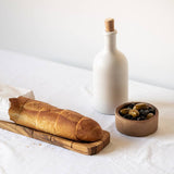 gharyan matte white stoneware bottle on table