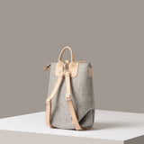 Rear view of a granite-colored Bedford Merino Wool Felt Midi Backpack by Graf Lantz featuring beige leather shoulder straps