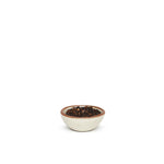A tiny rounded ceramic bowl in a warm, tan-toned, off-white color featuring iron speckles and an unglazed rim, filled with peppercorns