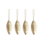 Four brass leaf-shaped ornaments with strings on a white background