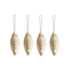 Four brass leaf-shaped ornaments with strings on a white background