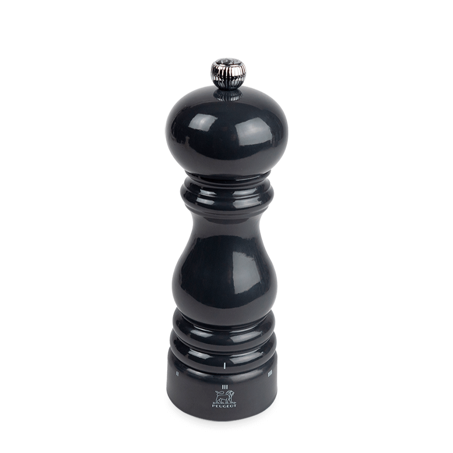 Black glossy pepper grinder on a white background