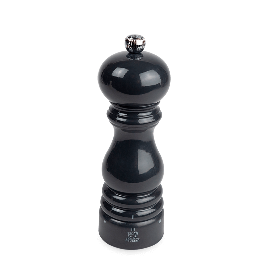 Black glossy pepper grinder on a white background