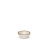 A tiny rounded ceramic bowl in a warm, tan-toned, off-white color featuring iron speckles and an unglazed rim