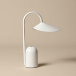 Minimalist white table lamp on a beige background
