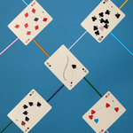 Five playing cards with different suits on a blue background