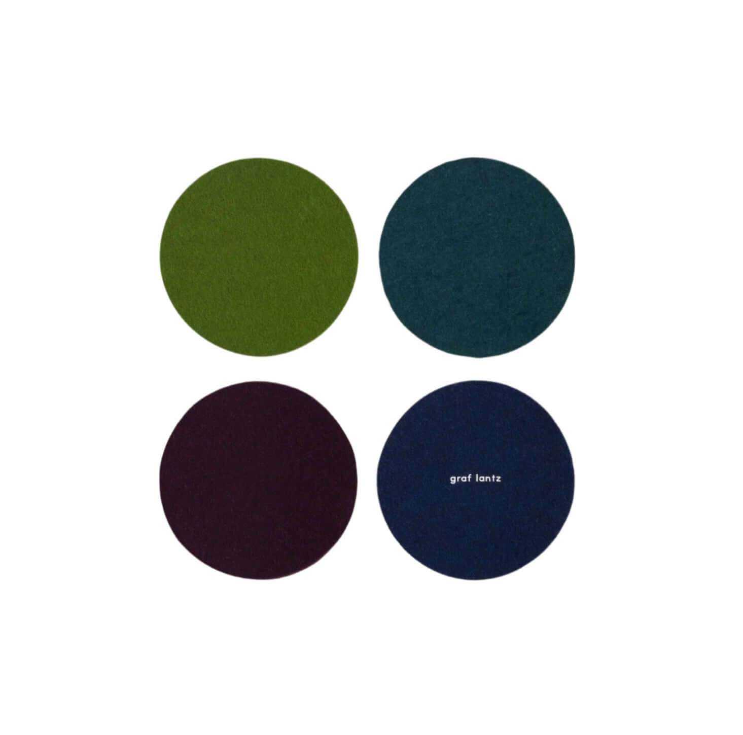 Four wool felt coasters in green, blue, purple, and navy with 'graf lantz' branding.