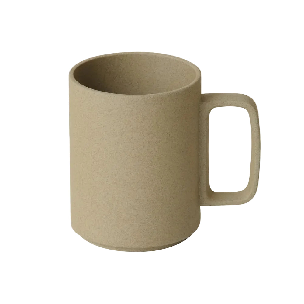 Beige mug with handle on a white background