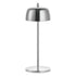 A modern table lamp with a polished chrome dome shade, slim central stem, and circular base, shown against a plain white background.