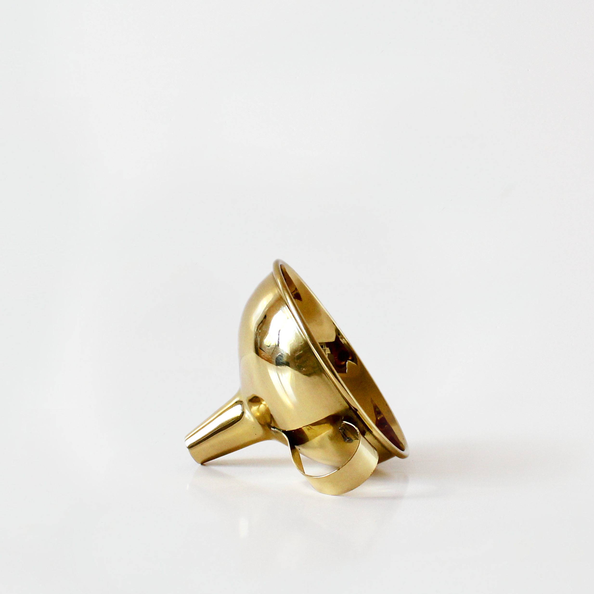 Gold funnel on a white background