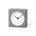 Gray square clock with a white face on a white background