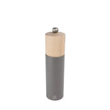 Gray pepper grinder with wooden top on a white background