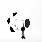 Black abstract sculpture on a white background