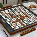 Scrabble board game on a table with tiles and a plate of cookies in the background