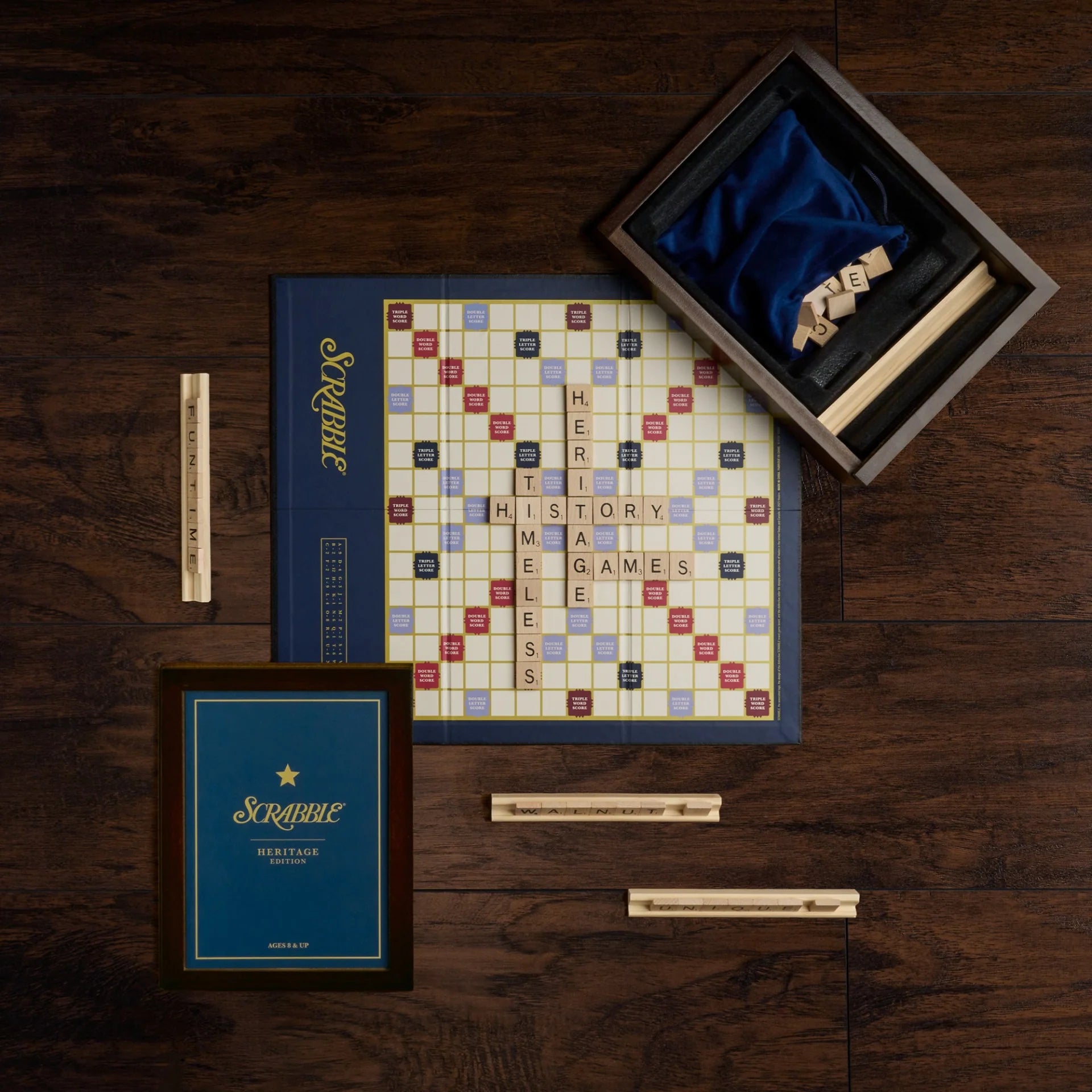 Scrabble board game set on a wooden surface with Scrabble pieces and box.