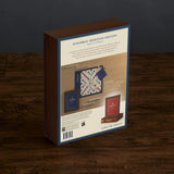 Scrabble Heritage Edition packaging on a wooden surface with a dark background