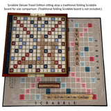 Scrabble Deluxe Travel Edition game board on top of a traditional folding Scrabble board for size comparison.