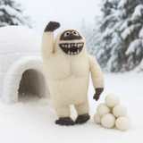 Plush Yeti in a snowy landscape with snowballs