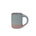 A medium sized ceramic mug with handle in a blue-grey color featuring iron speckles and unglazed rim.