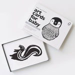 Art cards for baby with black and white illustrations of a penguin and skunk on a white background