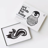 Art cards for baby with black and white illustrations of a penguin and skunk on a white background
