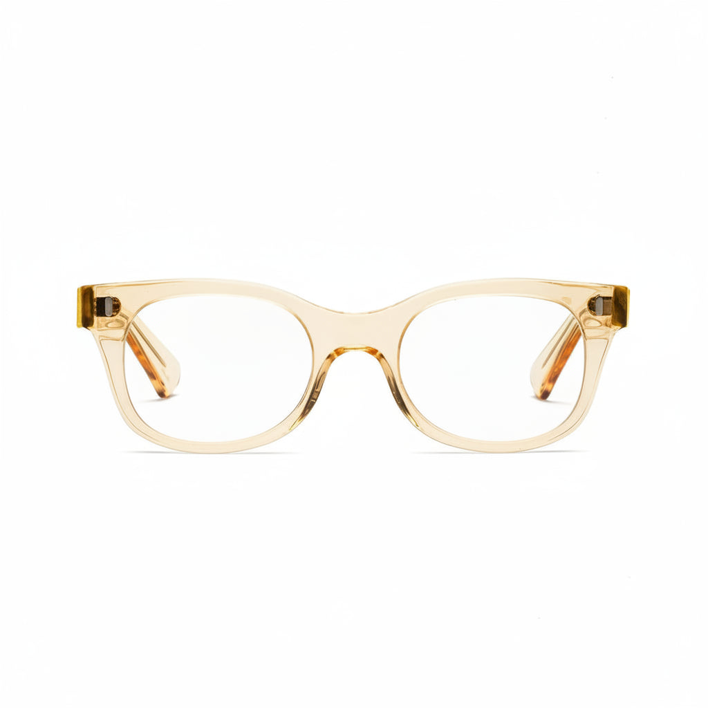 A pair of square-shaped, full frame eyeglasses with a raw honey color and metal accents on the arms.