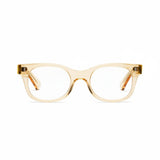 A pair of square-shaped, full frame eyeglasses with a raw honey color and metal accents on the arms.