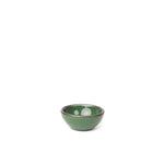 A tiny rounded ceramic bowl in a glossy emerald green color featuring iron speckles and an unglazed rim