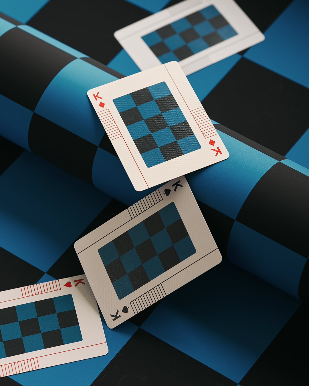 King playing card of different suits with checkered design on a blue and black checkered background